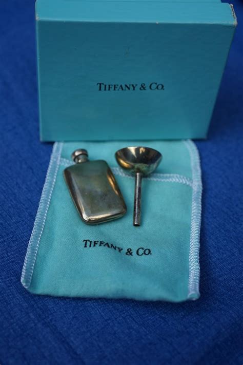 TIFFANY & TRAVEL PERFUME BOTTLE & FUNNEL. | EstateSales.org