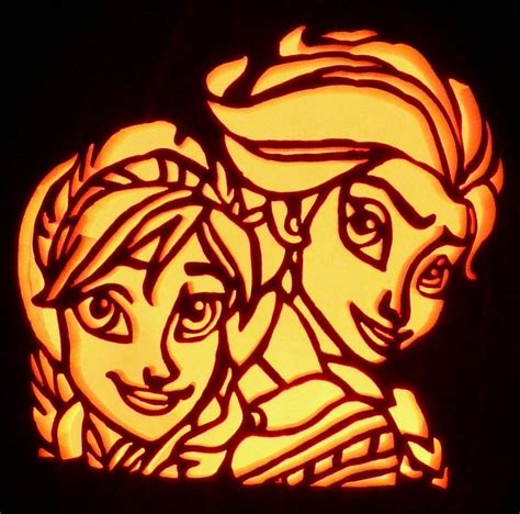 a carved pumpkin with an image of princess and prince