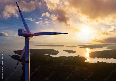 Wind generators over water. Windmills in lake area. Wind generators ...