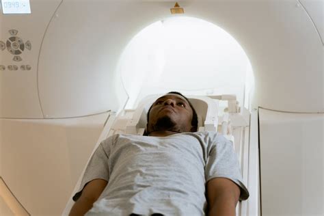 Photo Of Doctor Operating MRI Scanner · Free Stock Photo