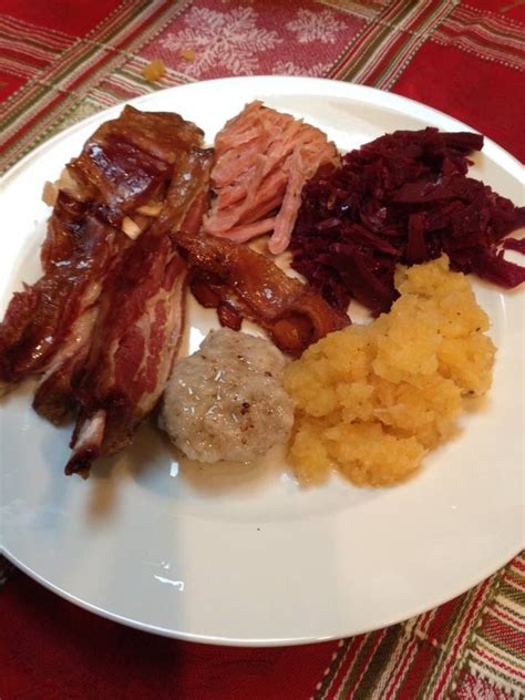 Traditional Norwegian Christmas Eve dinner Pinnekjott, Ham, Kumla, Rodkal and Mashed Swede. Made ...