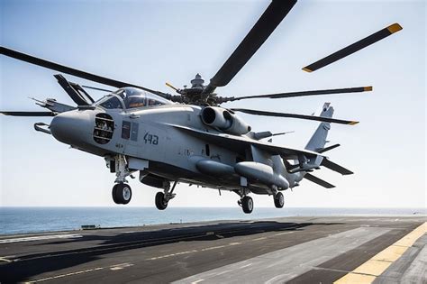 Premium Photo | Helicopter on the aircraft carrier Parked Taking off ...