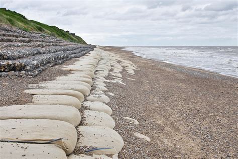 Sandbags on beach Photograph by Tom Gowanlock - Pixels