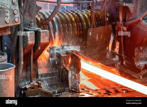 The process of rolling hot rolled steel in a rolling mill Stock Photo - Alamy