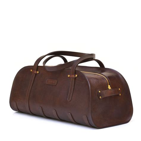 A classic accessory; the Leather Sports Bag is simply and solidly ...