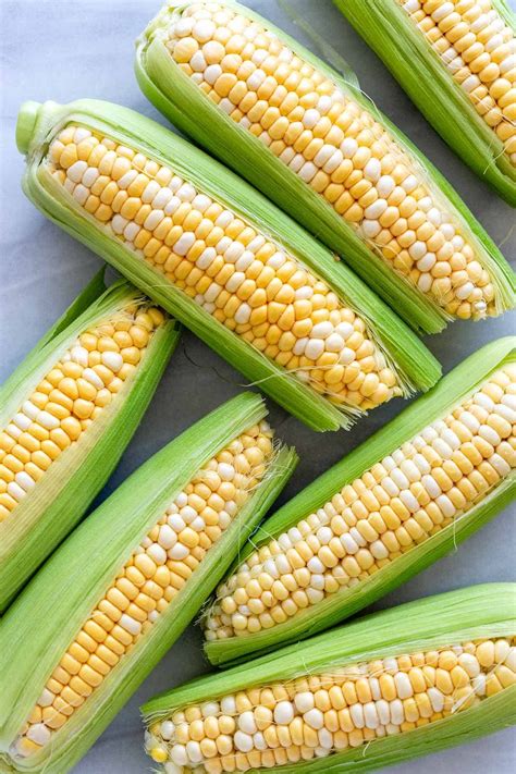 Learn how to cook corn on the cob 6 different ways! Microwaving, boiling, steaming, pressure ...