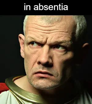 What does the Latin term "in absentia" mean?