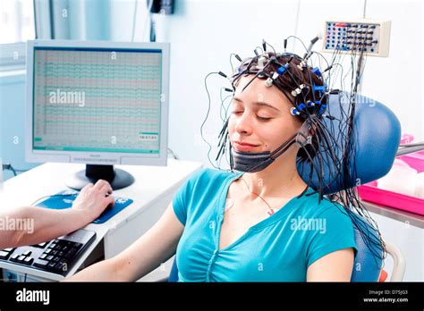 woman undergoing an electroencephalogram (EEG). Limoges hospital ...