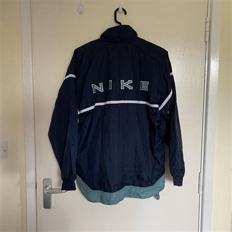 Fire Nike quarter zip waterproof/windbreaker jacket... - Depop