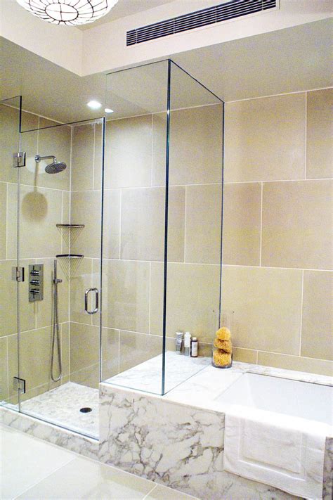 Limestone Tile Bathroom With Pebble Floor Shower | Bathroom tile ...