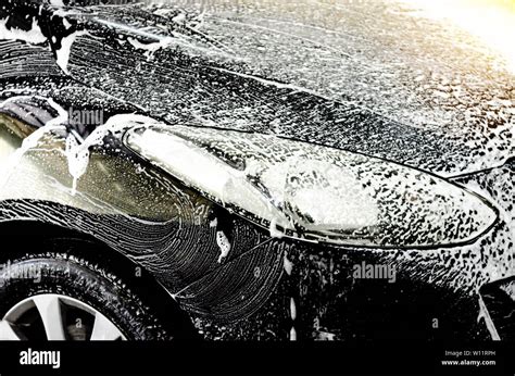 Car wash black with foam bubbles Stock Photo - Alamy