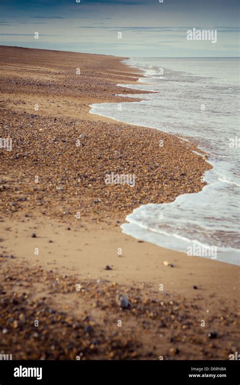 Shingle beach at Cley next the Sea, Norfolk, UK. Part of the shingle ...