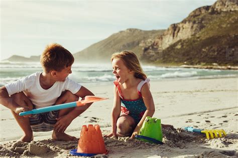 Kids Building Sandcastle On The Beach Photo (214579) - YouWorkForThem