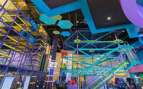 the inside of a building with various colored scaffolding