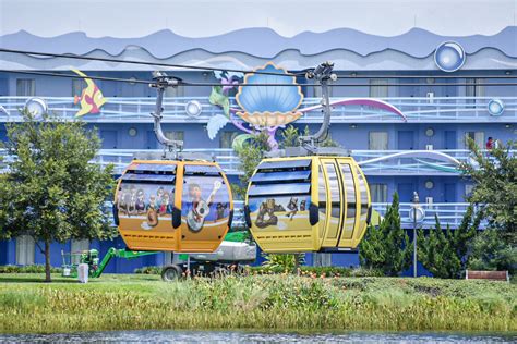 Unwrapped Disney Skyliner Gondolas Travel Over Hourglass Lake at Disney's Art of Animation Resort