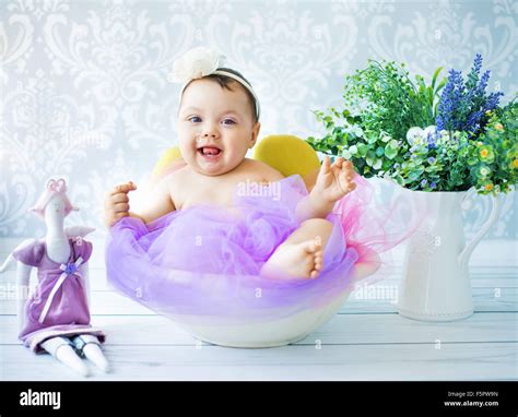 Cute baby playing in the colorful room Stock Photo - Alamy