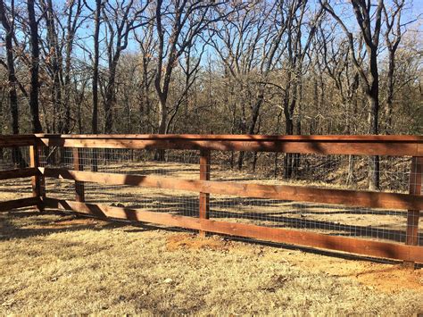 Three rail ranch fence with no climb and cap board. Installed by Titan Fence & Supply Company ...