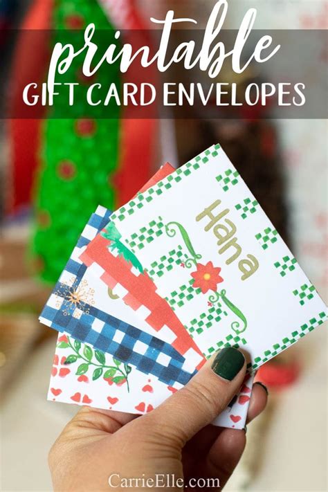 a hand holding three cards with the words printable gift card envelopes