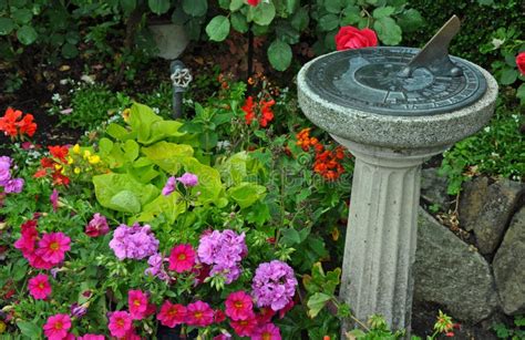 Garden sundial stock photo. Image of blooms, nature - 120996388