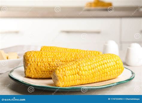 Delicious Boiled Corn on Table in Kitchen Stock Photo - Image of kitchen, object: 174733494