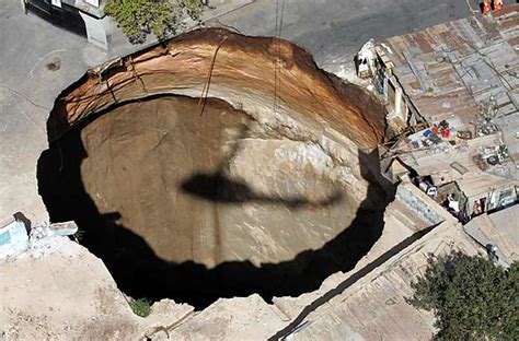 Crater in the middle of town | A huge crater formed after th… | Flickr