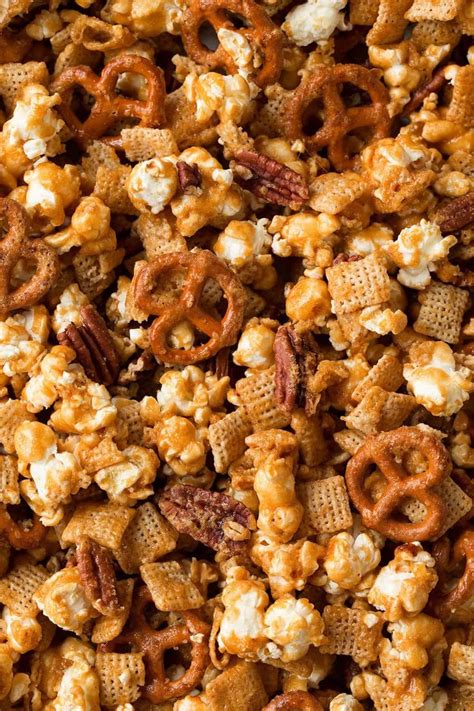 The best caramel popcorn! Made with popcorn, crisp rice cereal, salty pretzels and crunchy ...