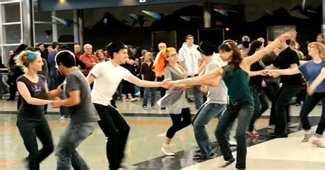 Swing dancing flash mob takes over Denver airport in seconds of music starting