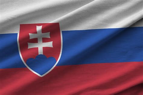 Premium Photo | Slovakia flag with big folds waving close up under the ...