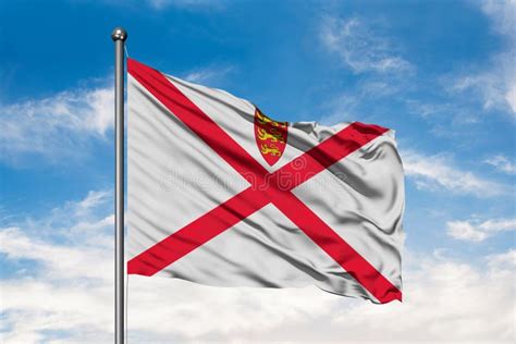 Flag Of Bailiwick Of Jersey Waving In The Wind Against White Cloudy Blue Sky Stock Photo - Image ...