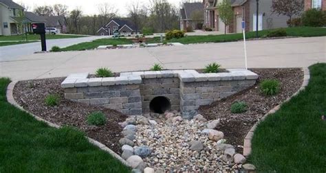 Pin on Garden design | Driveway entrance landscaping, Landscaping retaining walls, Front yard ...