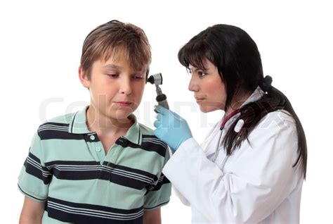 A doctor uses an otoscope (auroscope)to ... | Stock image | Colourbox