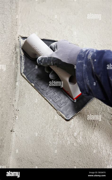 Roughcast, plastering trowel, new homes under construction, construction site Stock Photo - Alamy