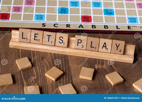 Scrabble Board Game with the Scrabble Tile Spell `Lets Play` Editorial Photography - Image of ...