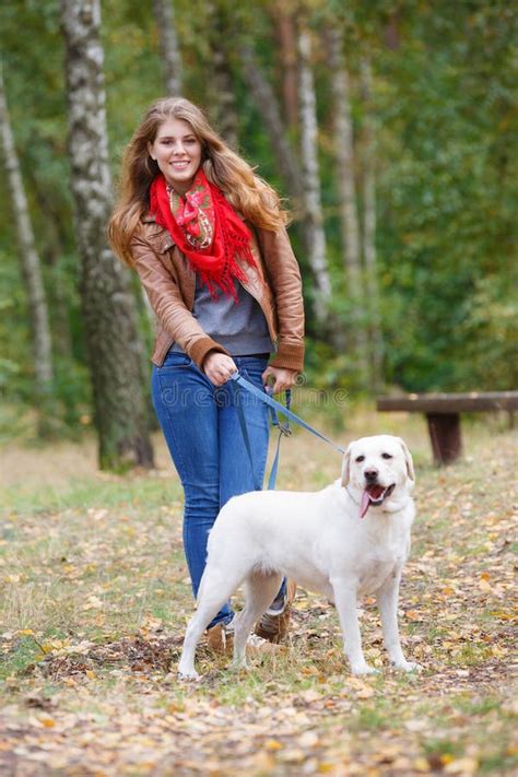 Beautiful Woman Walking with Her Dog Stock Image - Image of beautiful, outside: 34079621