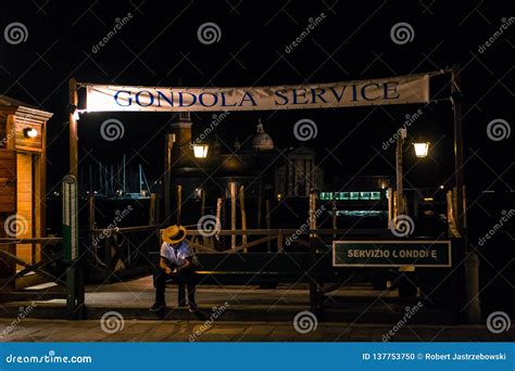 Venice Gondola Station at Night with Sitting Gondola Man Editorial ...