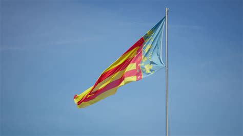 Flag of Valencia against a clear sky 26235509 Stock Video at Vecteezy