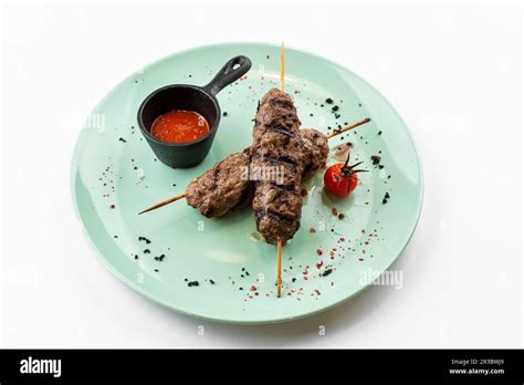 Turkish kebab with tomato sauce Stock Photo - Alamy