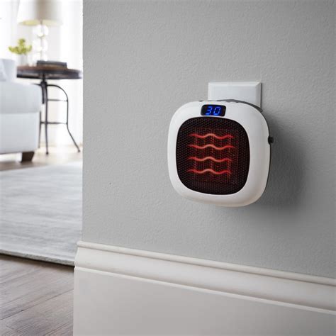 The 750 Watt Wall Outlet Heater - Hammacher Schlemmer Room Heater ...