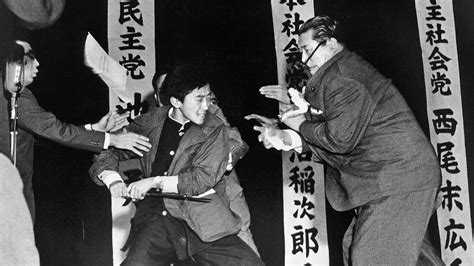 1960: Inejirō Asanuma, already mortally wounded, watches his sword-wielding killer strike again ...