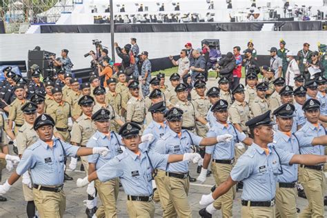 Malaysian Police Personnel Marching in Retro Uniform during 65th ...