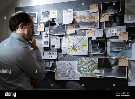 Policeman Or Private Detective Searching Crime Investigation Board Stock Photo - Alamy