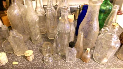 vintage antique glass bottles dug from dirt making spirit bottles – Den ...