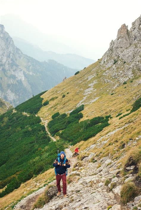 Hikers Making Their Way Up a Rugged Mountain Trail Stock Photo - Image ...