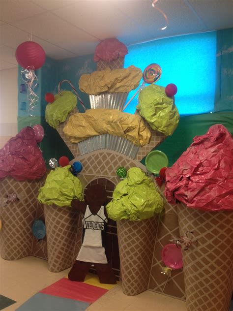 some ice cream cones are sitting in the middle of a room with decorations on it