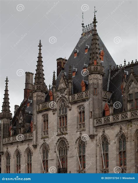 Two Old Style Clock Towers with a Clock Tower at the Front Stock Photo - Image of illuminated ...