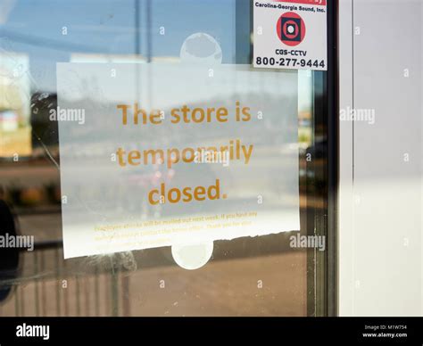 Store closed sign on the door to a shuttered or closed down business in Montgomery Alabama ...