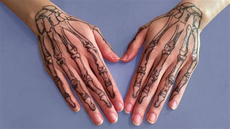20 Cool Skeleton Hand Tattoo Ideas & Meaning - The Trend Spotter