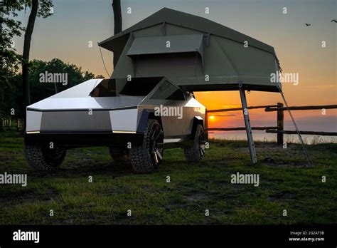 Tesla Cybertruck with a tent at a forest camp Stock Photo - Alamy