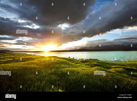 Sunrise scene on lake Stock Photo - Alamy