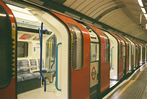 an empty london underground train at a station, empty london tube train ...